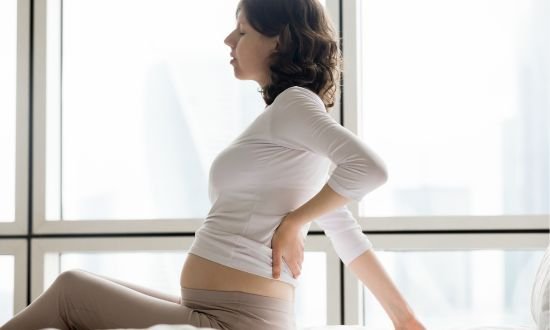 Back pain with nausea or vomiting in pregnancy